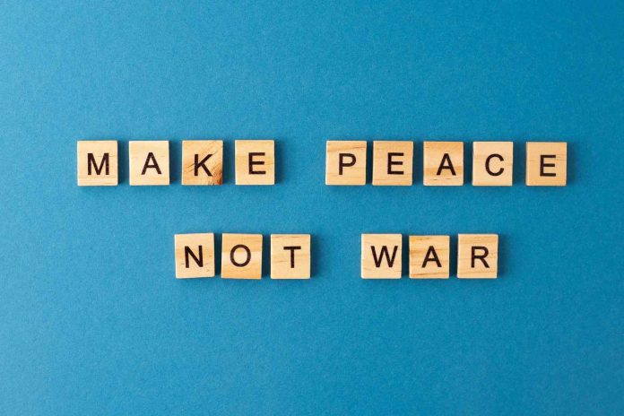make-peace-not-war-background-phrase-from-wooden-2025-03-10-12-43-34-utc